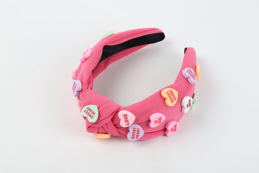 Vincha rosada con diseño